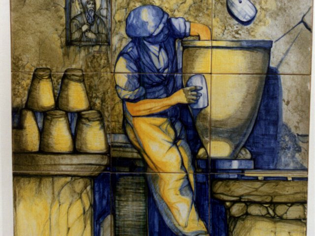 Pannello  - Pannello maiolicato raffigurante un torniante al lavoro. Opera di Roberto Rosati.Scarica il file